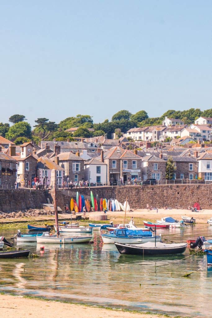 A quick guide to the best things to do in Mousehole, an Adorable Cornish Fishing Village Frozen in Time, South Cornwall, England. Cute cafes, ancient fishing port, rugged hiking trails, etc.