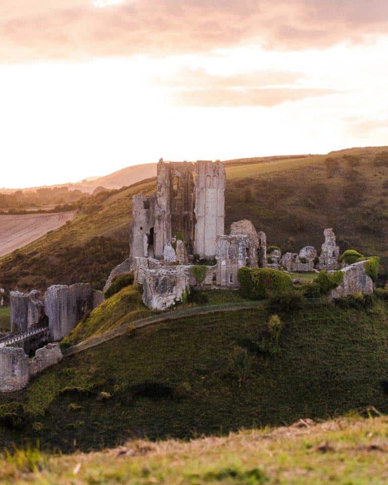 How to See Corfe Castle at Sunset, the Norman Fairytale Castle of Dorset, England