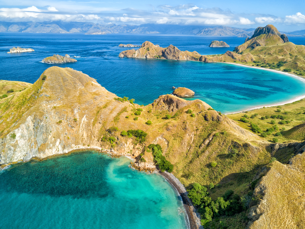 Aerial view of two aquamarine bays on Pulau Padar island 