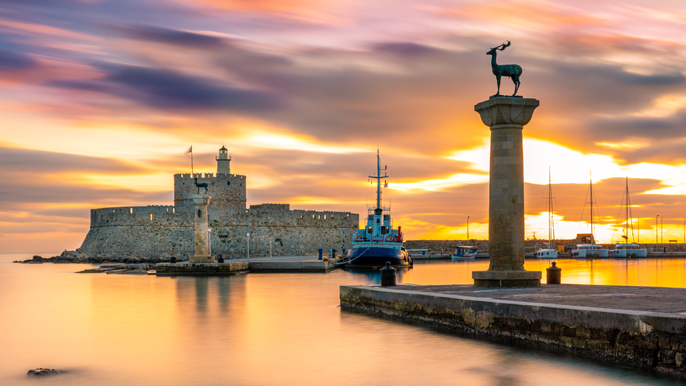 Golden sunrise in Mandraki harbour