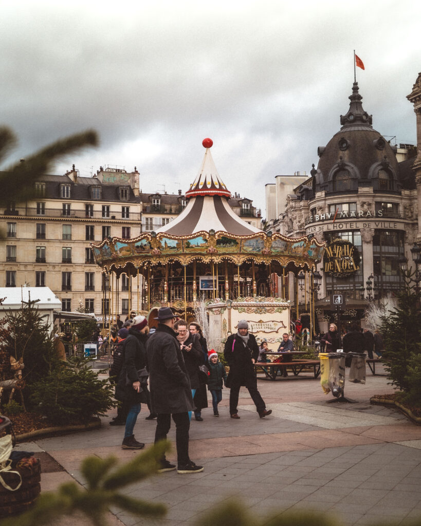people walking in front of Hotel de ville Christmas market