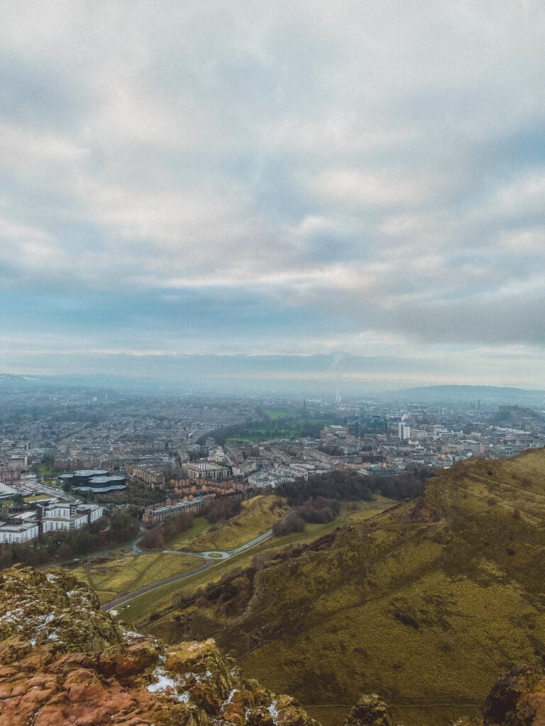 view from the top of arthurs seat in edinburgh on a cloudy day