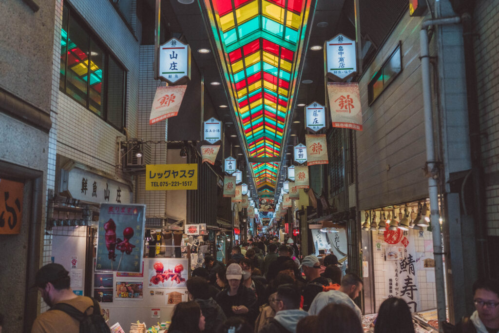 view of nishiki market with crowd of people in kyoto, japan