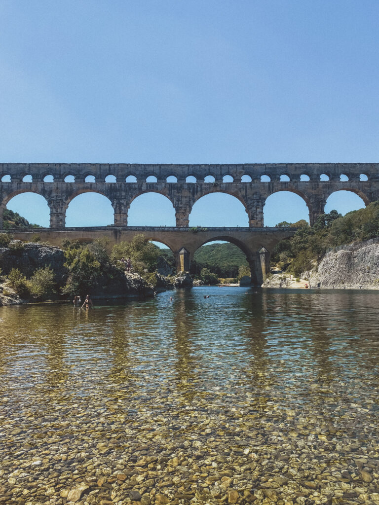 view of pont du gard from the water