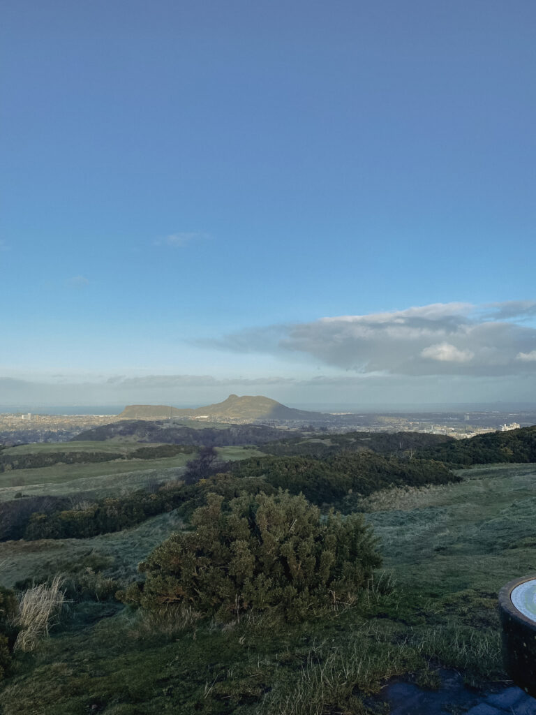 view of arthurs seat and city from the braids hills edinburgh
