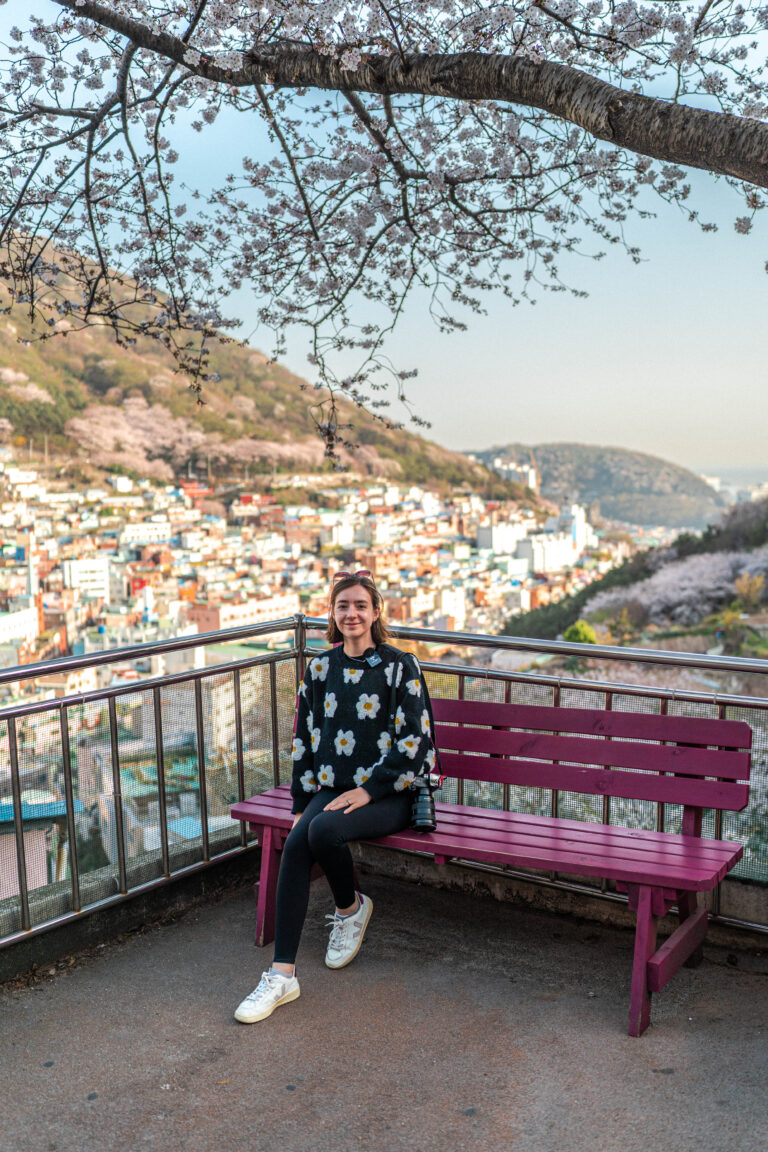 sophie nadeau sat on bench in front of gamechon view