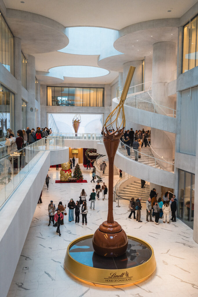 Lindt home of chocolate, world's largest chocolate fountain dripping down from a huge whisk